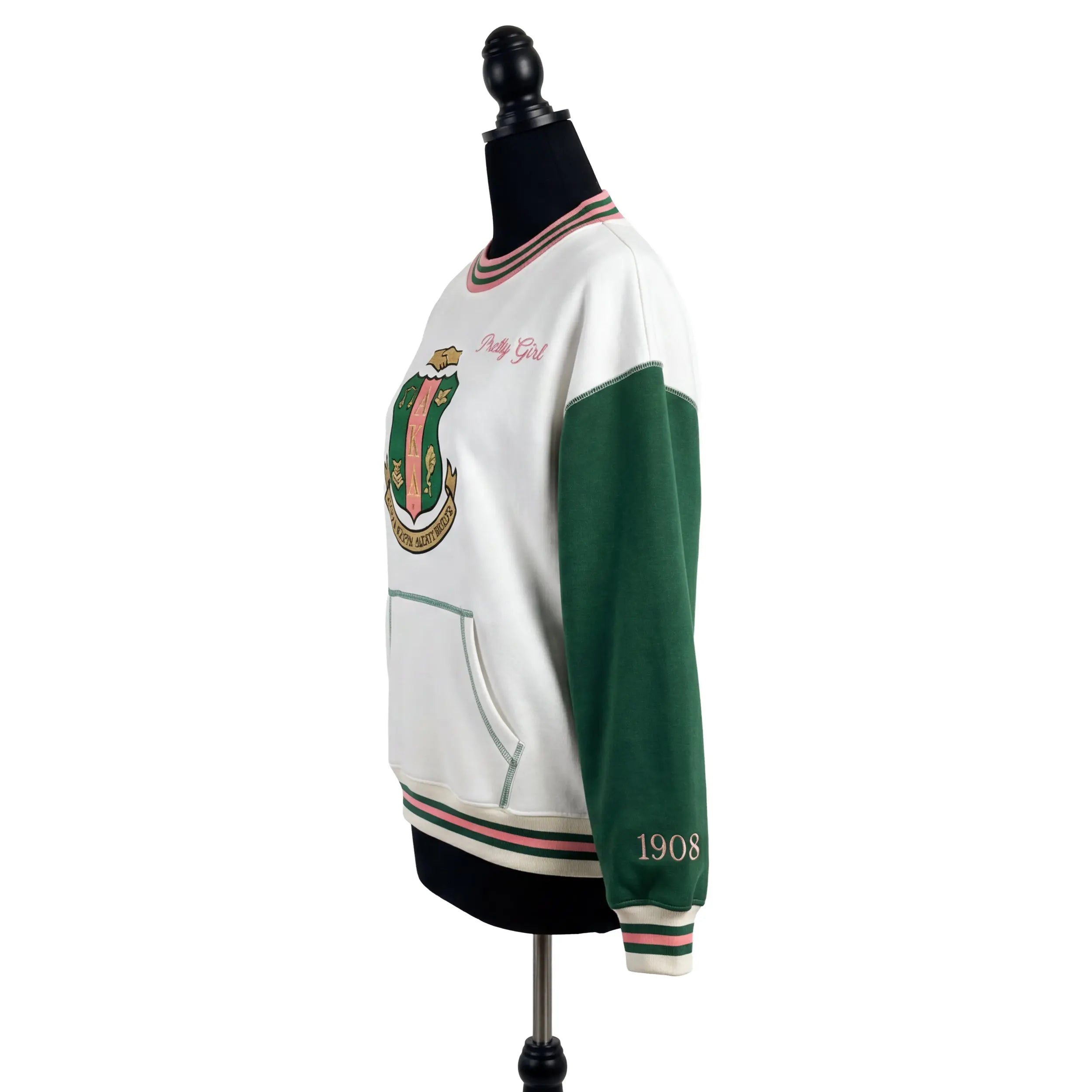 White and green varsity jacket on a mannequin with a white background