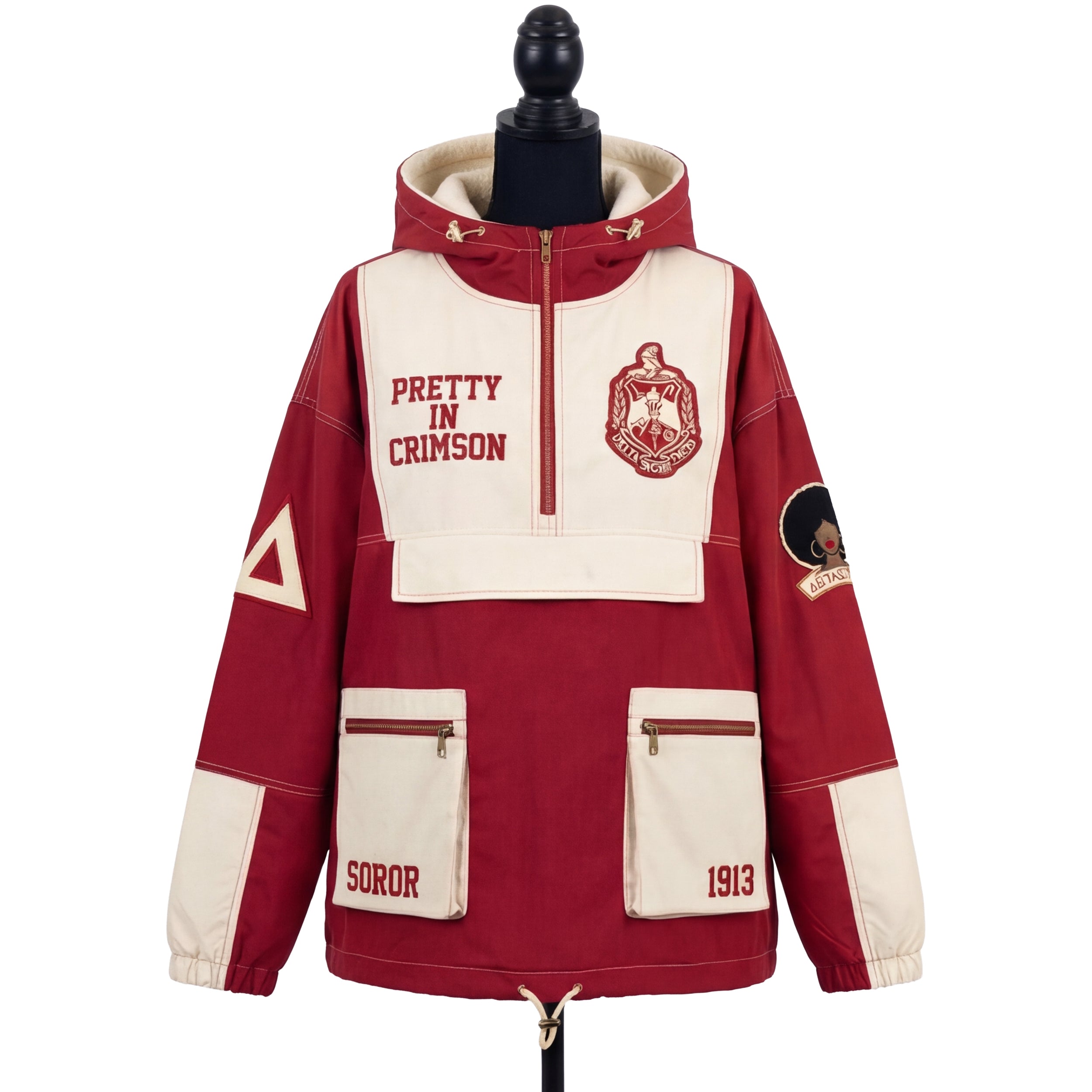 Red and cream jacket with 'Pretty in Crimson' text and a logo on a mannequin against a white background