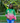 Person wearing a green and pink letterman jacket with 'A K A' on it, standing outdoors.
