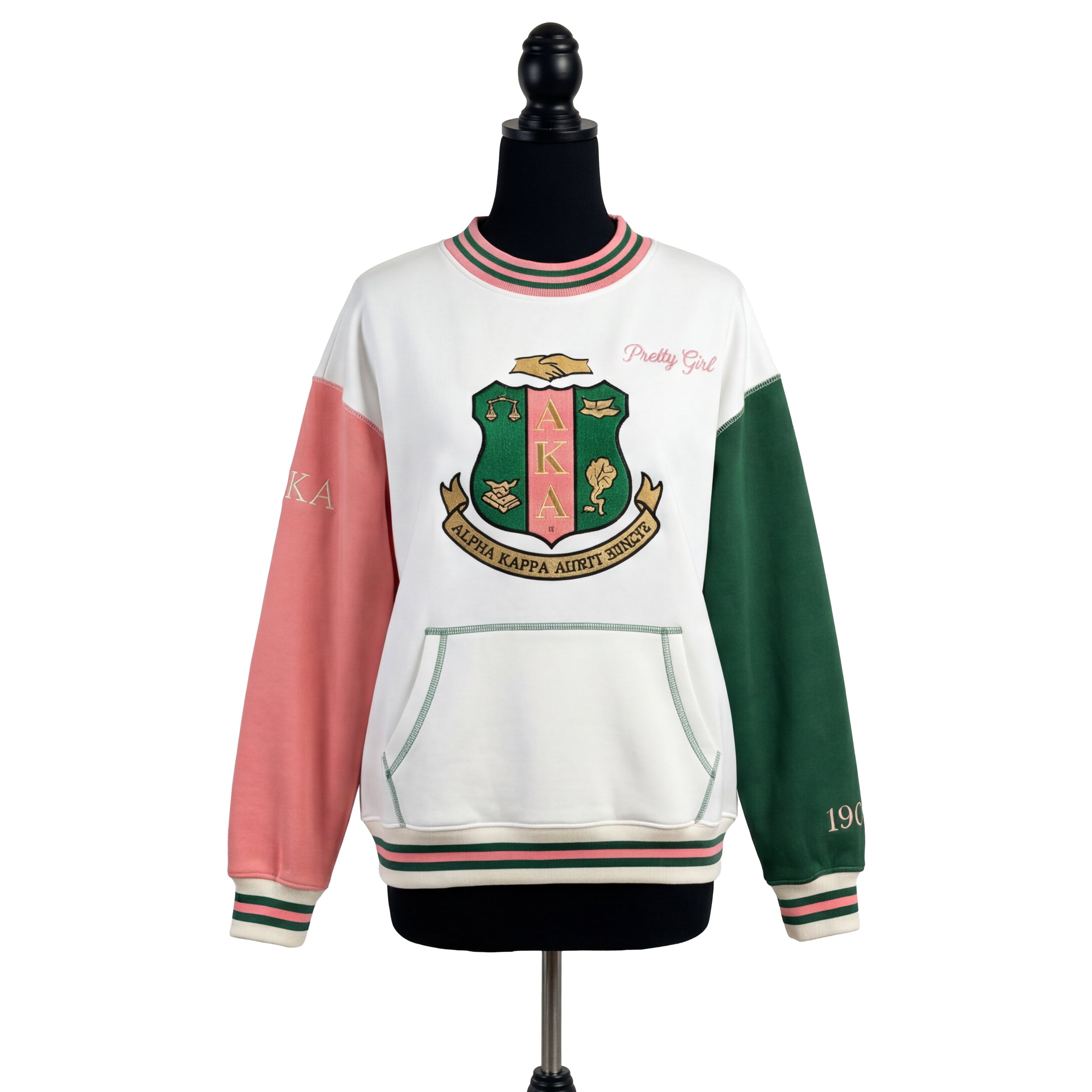 Sweatshirt with a crest design on a mannequin against a white background